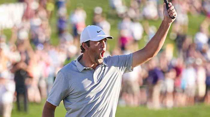Scottie Scheffler celebrates during the 2022 WM Phoenix Open.